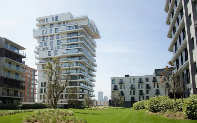 a couple of tall buildings sitting next to each other